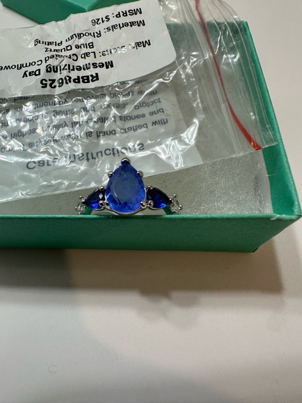 Brand new size 8 Blue Teardrop Solitaire Ring with Accent Stones